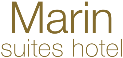 The image contains the logo for "Marin suites hotel" with the text in a gold color on a transparent background.