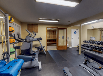 fully equipped workout room free weights, resistance training, and machines